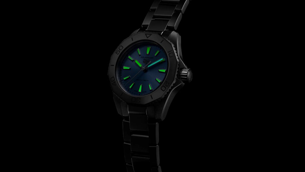 Dark photo showcasing the lume of an Aquaracer 200 women's dive watch.